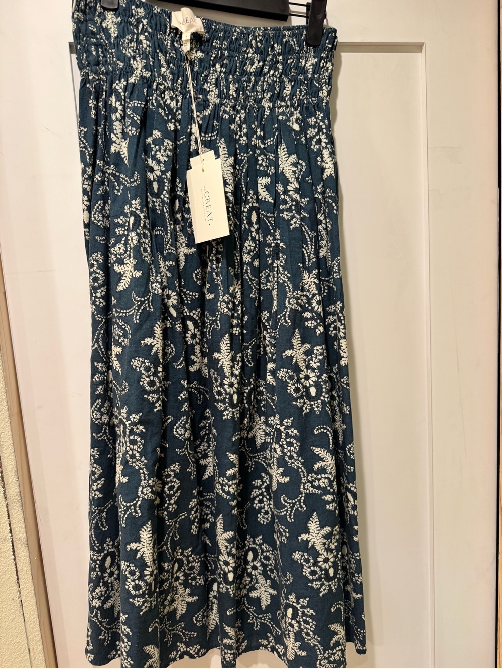THE GREAT. Navy and White Floral Smocked Midi Skirt - Picture 3 of 5